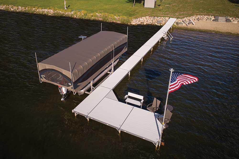 FLOE L-shaped dock with platform and seating area on shoreline